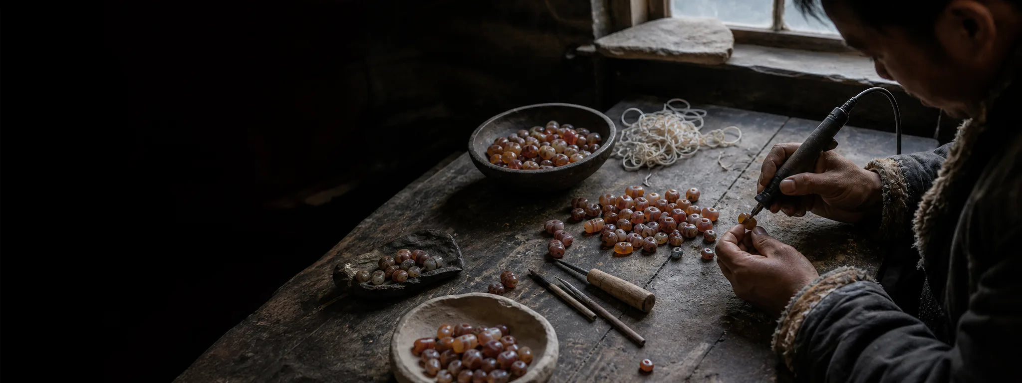 Tibetan-inspired artisan scene selecting and polishing agate beads