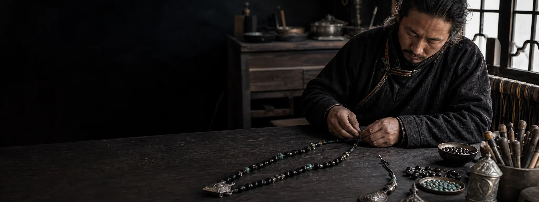 Tibetan-inspired artisan scene hand-assembling a beaded necklace