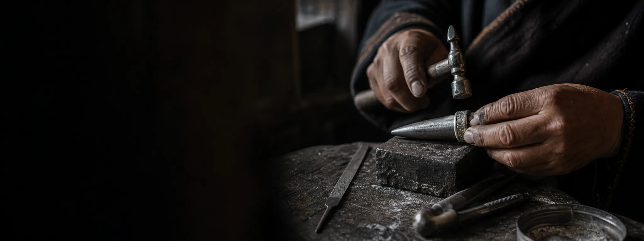 Tibetan-inspired artisan scene forming and polishing a silver-tone ring