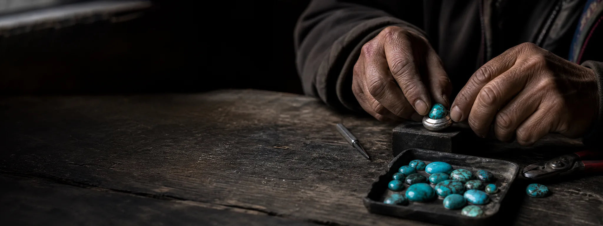 Tibetan-inspired artisan scene setting a natural turquoise cabochon